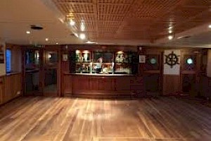 Remodelled aft superstructure - Now the bar, with ship's wheel and bell
